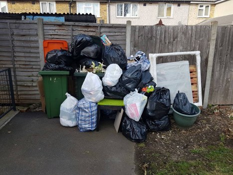 Business professionals managing waste in Putney office